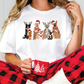 a woman sitting on the floor wearing pajamas and a t - shirt with reindeers