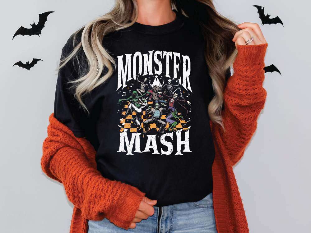 a woman wearing a black monster mash t - shirt