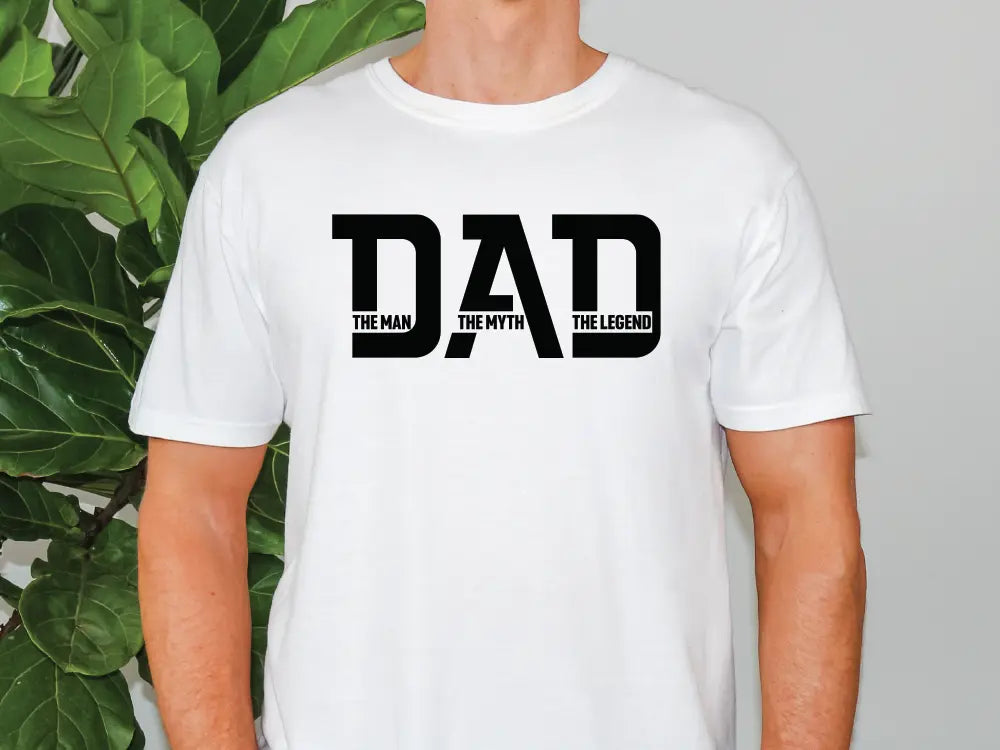 a man wearing a white shirt with the word dad printed on it