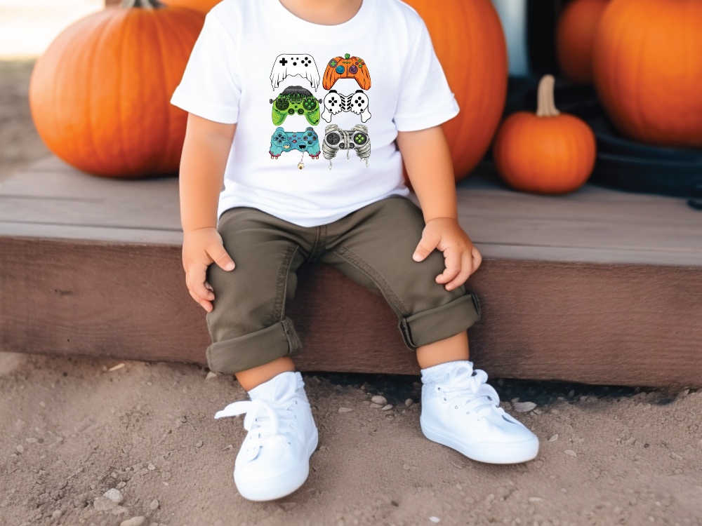 a little boy sitting on a step next to pumpkins