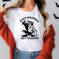 a woman wearing a t - shirt that says even baddies get saddles