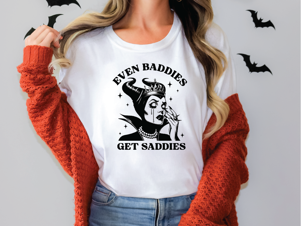 a woman wearing a t - shirt that says even baddies get saddles