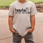 a young boy wearing a baseball t - shirt with the word baseball on it