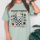 a woman wearing a t - shirt with a checkered candle on it
