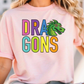 A person wearing a pink t-shirt with the text "DRA GONS" printed on it, along with a colorful dragon graphic.