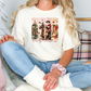 a woman sitting on a couch wearing a white shirt