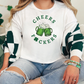 a woman sitting on a couch wearing a green and white shirt