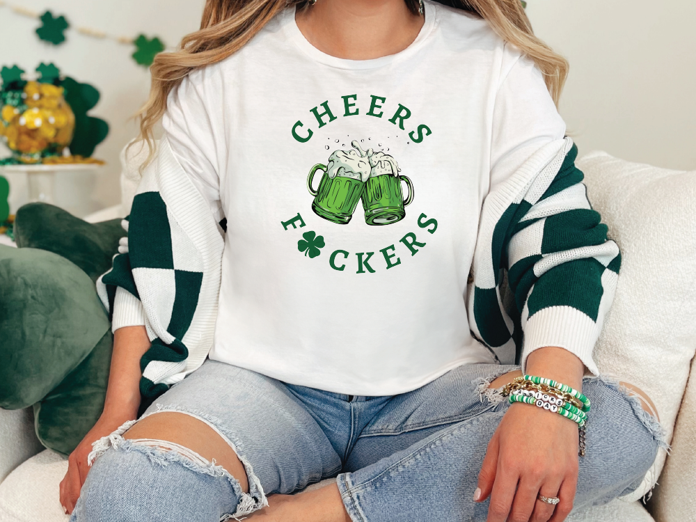 a woman sitting on a couch wearing a green and white shirt