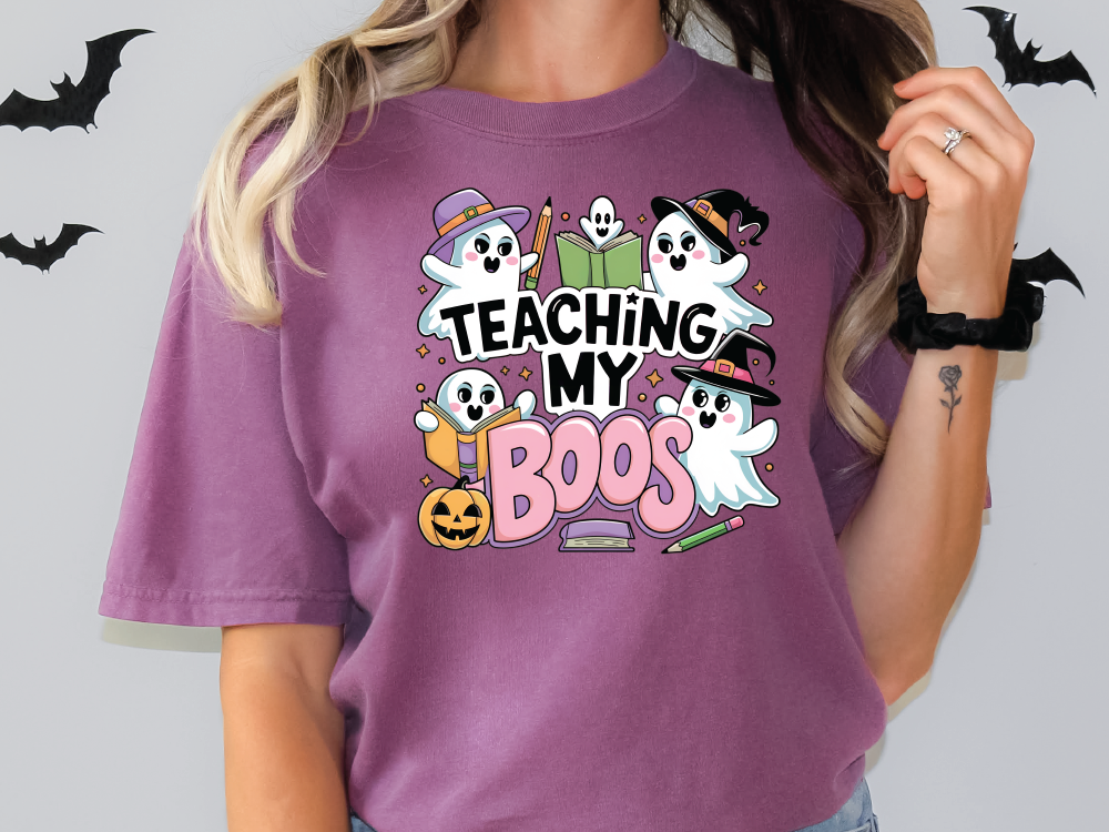 a woman wearing a purple teaching my boos t - shirt