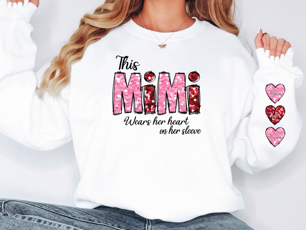 a woman wearing a white shirt with the word mom on it