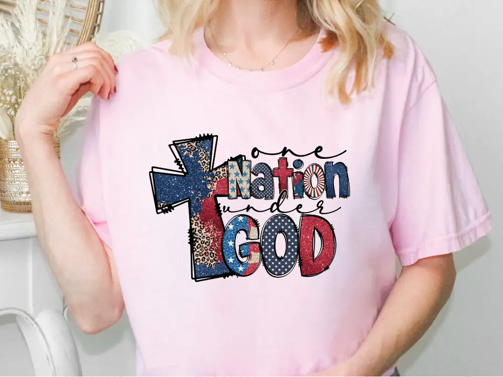 a blonde woman wearing a pink t - shirt that says nation of god