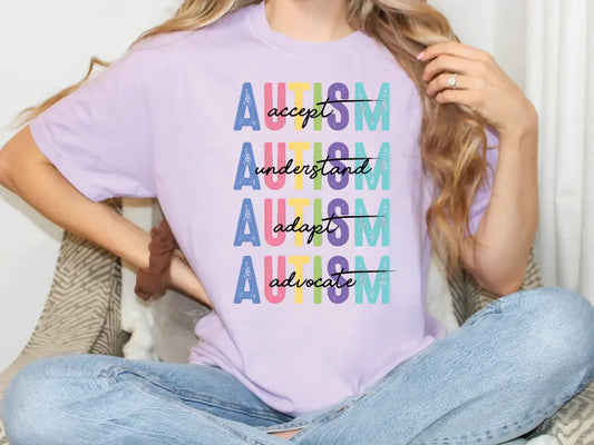 a woman sitting on a couch wearing a t - shirt that says autism