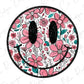 a pink and blue flowered smiley face on a white background