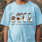 A light blue t-shirt with a graphic design of four cartoon ducks, each wearing a different type of hat and holding a football, along with the text "Just a football goose".