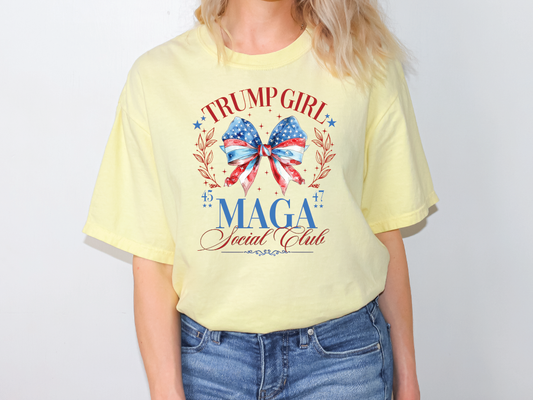 a woman wearing a yellow trump girl t - shirt