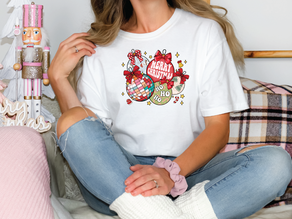 a woman sitting on a bed holding a baby