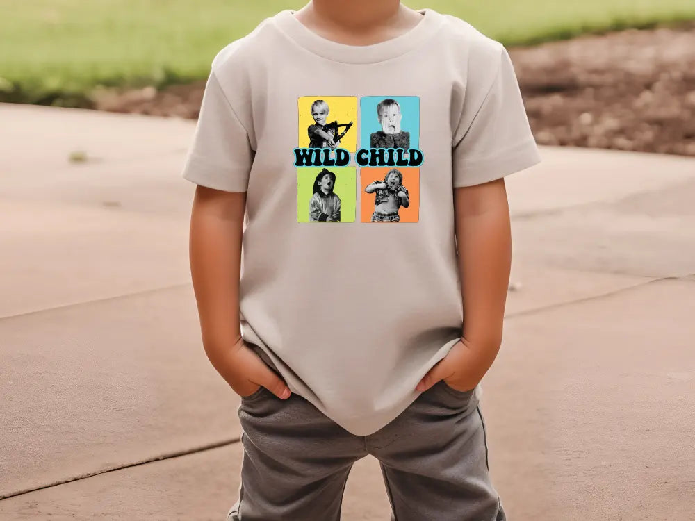 a young boy wearing a t - shirt with the words wild child on it