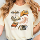 a woman wearing a t - shirt with books on it