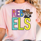 A woman wearing a pink t-shirt with the text "REBELS" and a cartoon character on it.