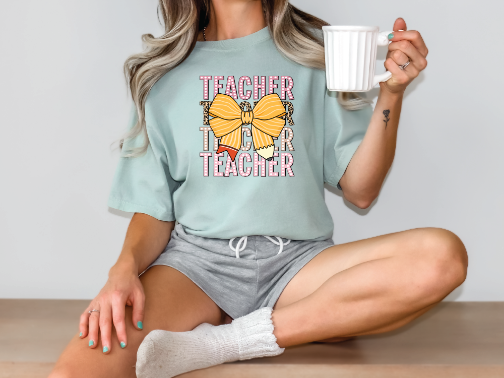 a woman sitting on the floor holding a coffee cup