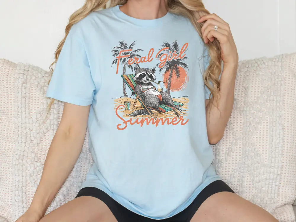 a woman sitting on a couch with a raccoon on her shirt