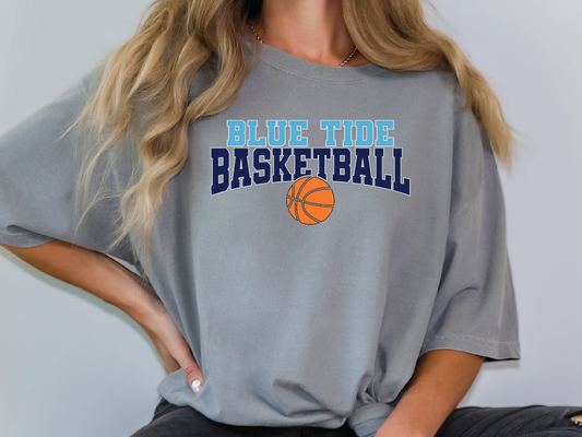 a woman wearing a blue tide basketball t - shirt