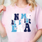 a woman wearing a pink shirt that says, i'm my blue tide era