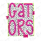 the text "GATORS" in a bold, pink font against a background of black and white polka dots.