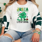 a woman sitting on a couch wearing a st patrick's day shirt