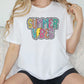 a woman sitting on a couch wearing a shirt that says summer vibes