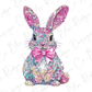 A colorful, glittery bunny wearing a pink bow tie sits against a white background.