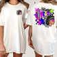 A white t-shirt with a colorful graphic design on the back, featuring a Native American headdress and stars.