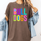 A person wearing a brown t-shirt with the text "Bull Dogs" in colorful letters.