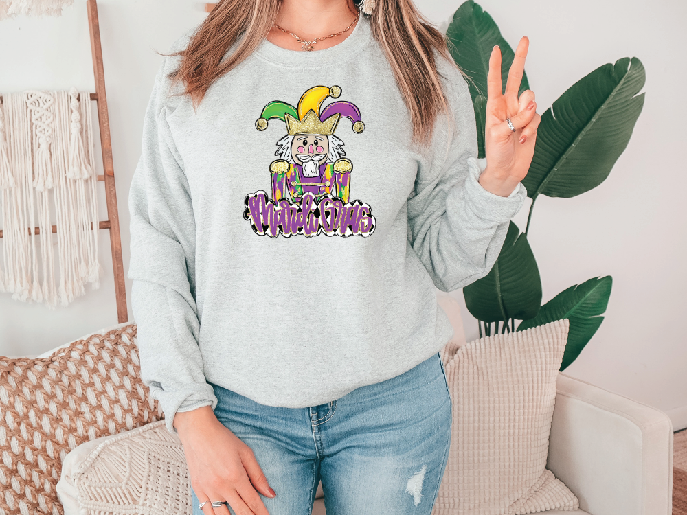 a woman wearing a sweatshirt with a cartoon character on it