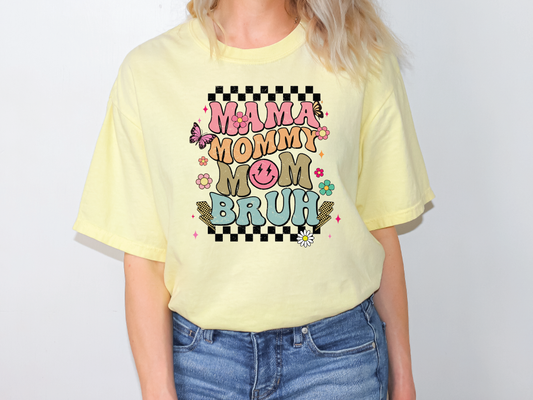 a woman wearing a yellow shirt that says mama's mom and brunch