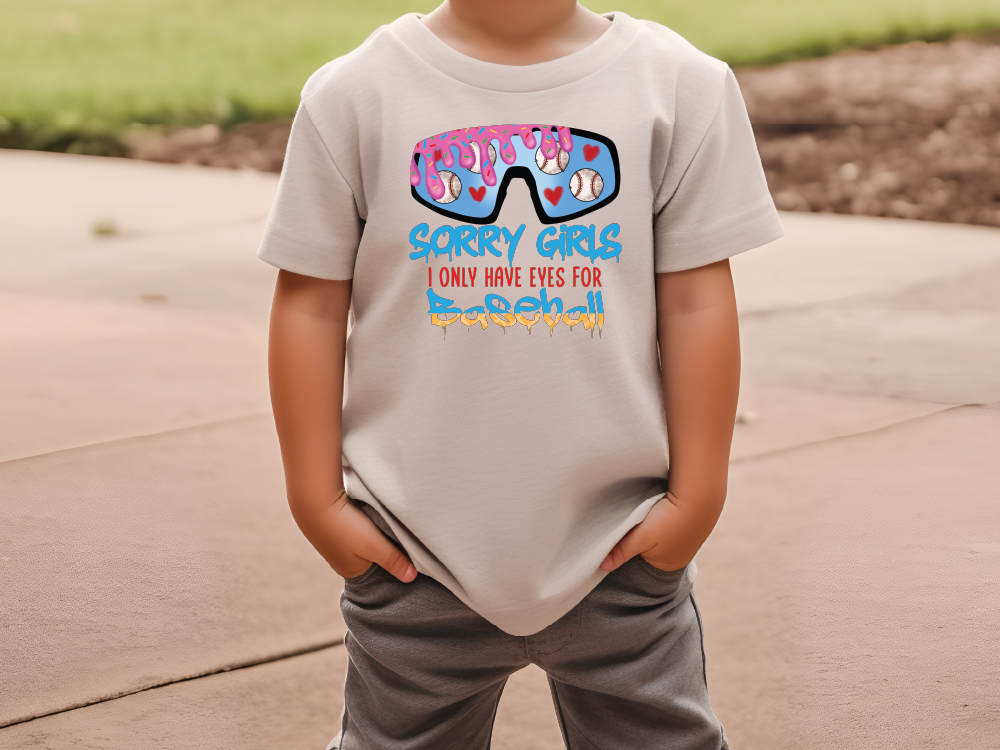 a young boy wearing a t - shirt with sunglasses on it