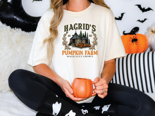 a woman sitting on a bed holding a pumpkin mug