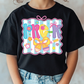 a young girl wearing a black shirt with the words rock on it