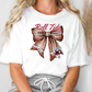 a woman wearing a t - shirt with a bow on it