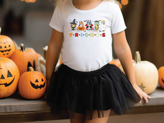 a little girl wearing a white shirt and black skirt