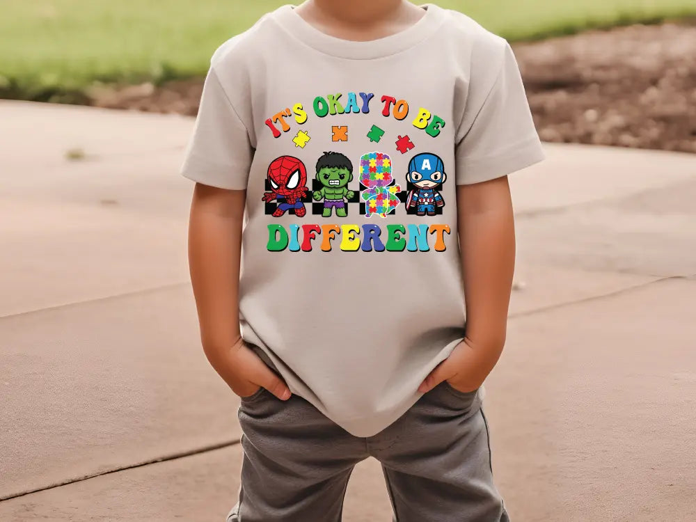 a young boy wearing a t - shirt that says it's okay to be