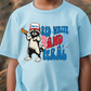 a young boy wearing a blue shirt with a cat in the hat on it
