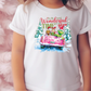 a little girl wearing a white shirt with a pink truck on it