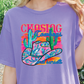 a woman wearing a purple shirt with a cactus on it