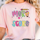 a woman wearing a pink t - shirt that says make that sweet score