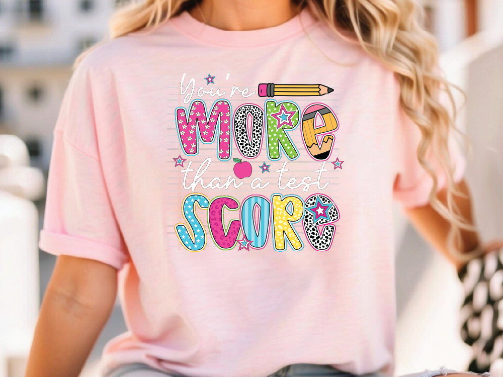 a woman wearing a pink t - shirt that says make that sweet score