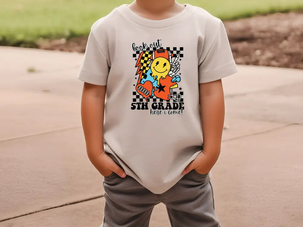 a little boy that is wearing a shirt