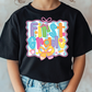 a young girl wearing a black t - shirt that says first grade