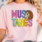A woman wearing a pink t-shirt with the text "MUS TANGS" printed on it.
