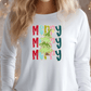 A woman wearing a white long-sleeved shirt with a colorful graphic design featuring the word "Merry" repeated in a festive pattern.